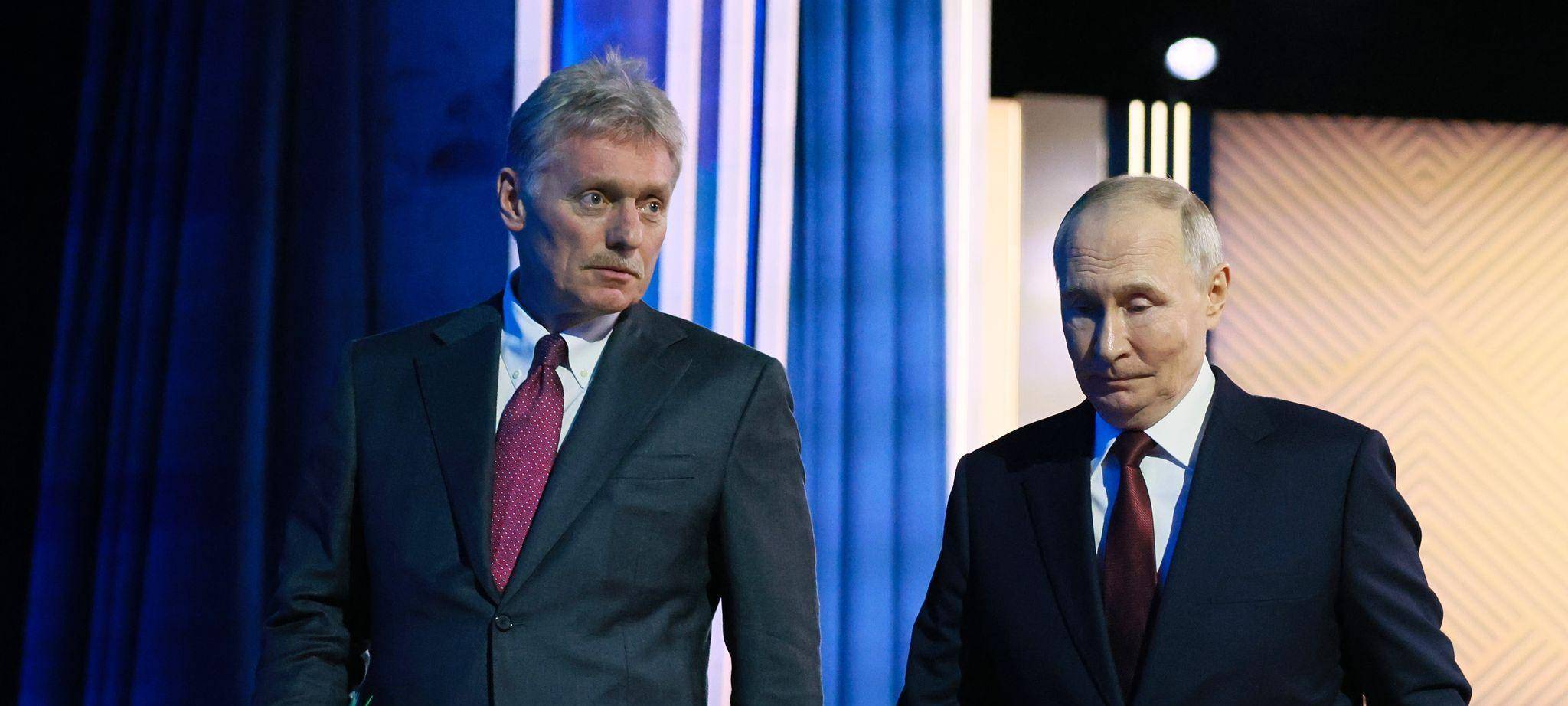 Putin und sein Pressesprecher Peskow